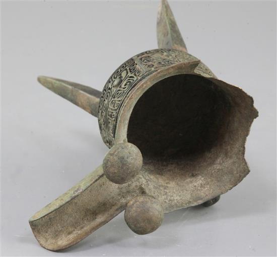 A Chinese archaic bronze tripod ritual wine vessel, Jue, Shang dynasty, 13th-12th century B.C., Anyang, 17cm high, large losses to rim